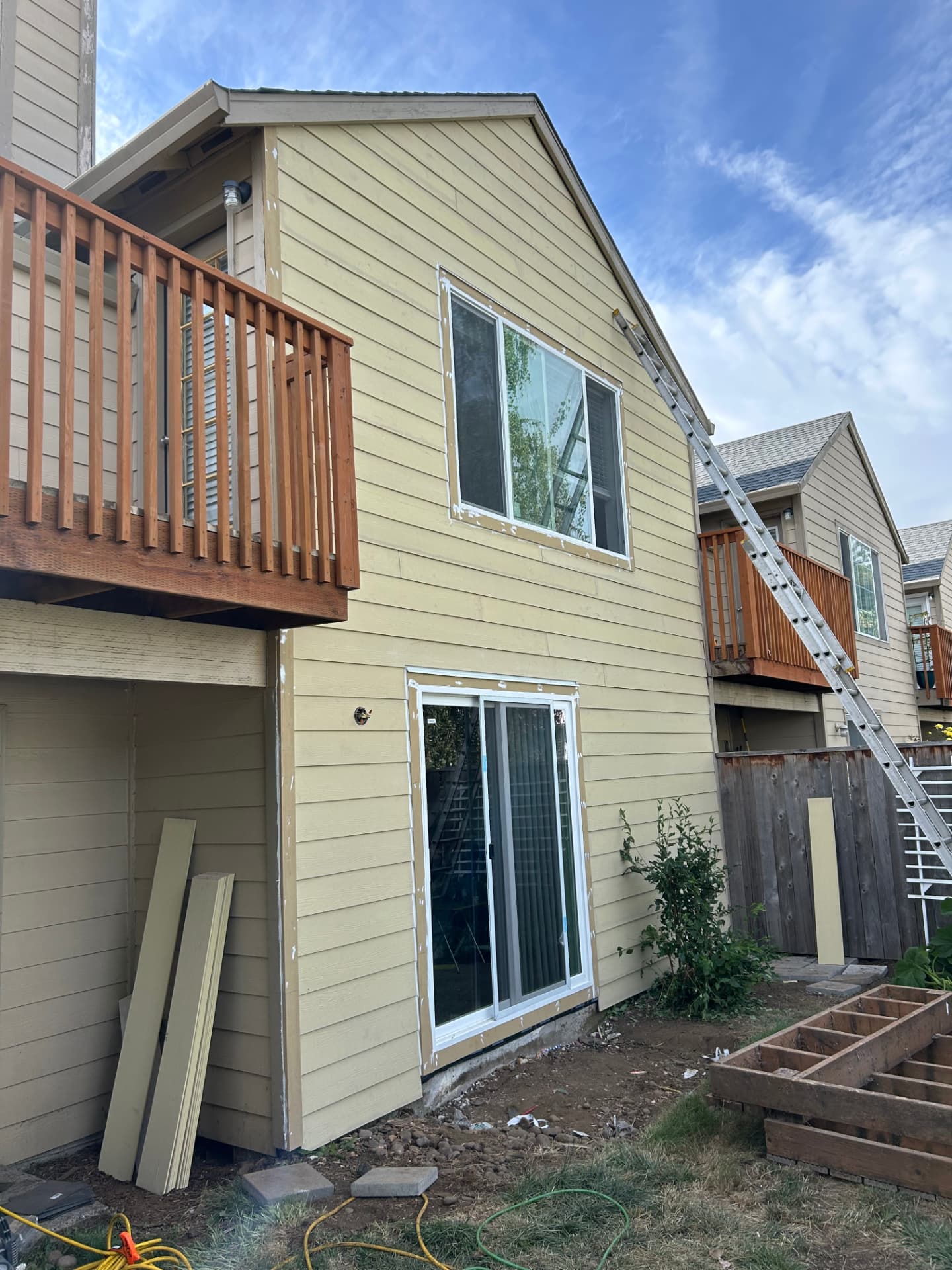 Multifamily exterior restoration with new siding and windows